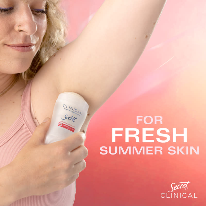 Woman applying Secret Clinical deodorant for fresh summer skin in a promotional image