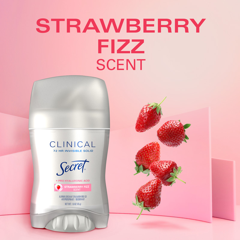Secret Clinical Invisible Solid Strawberry scent deodorant stick with strawberries in the background