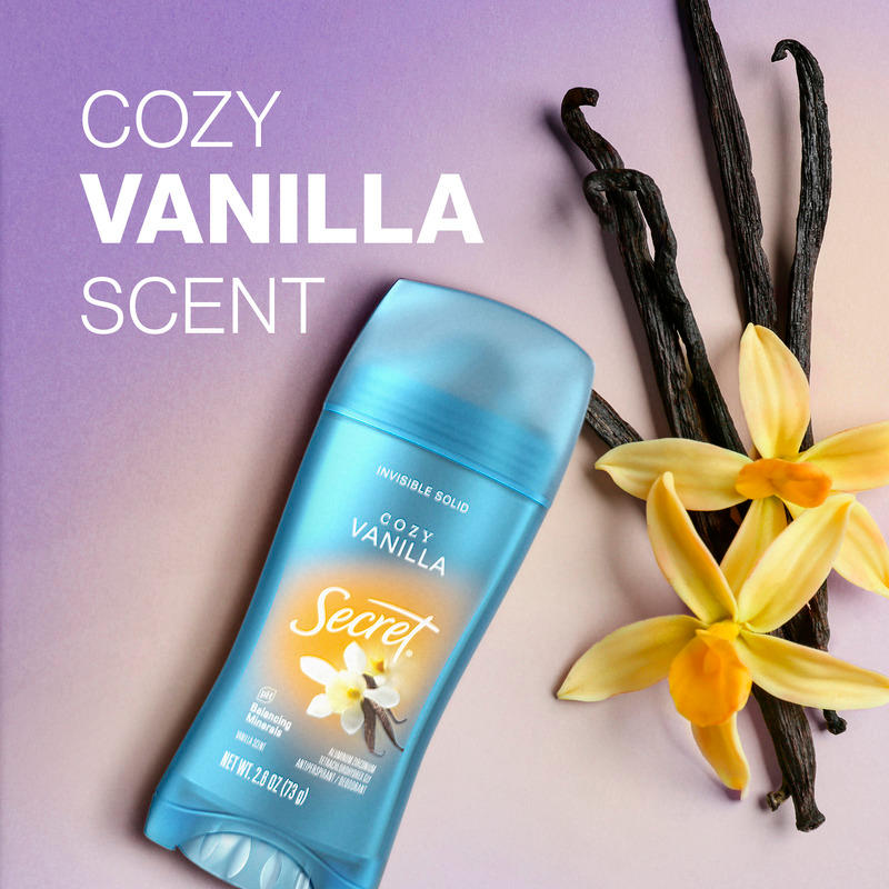 Cozy vanilla scent Secret deodorant with natural vanilla pods and flowers on a gradient background, showcasing its inviting aroma and freshness