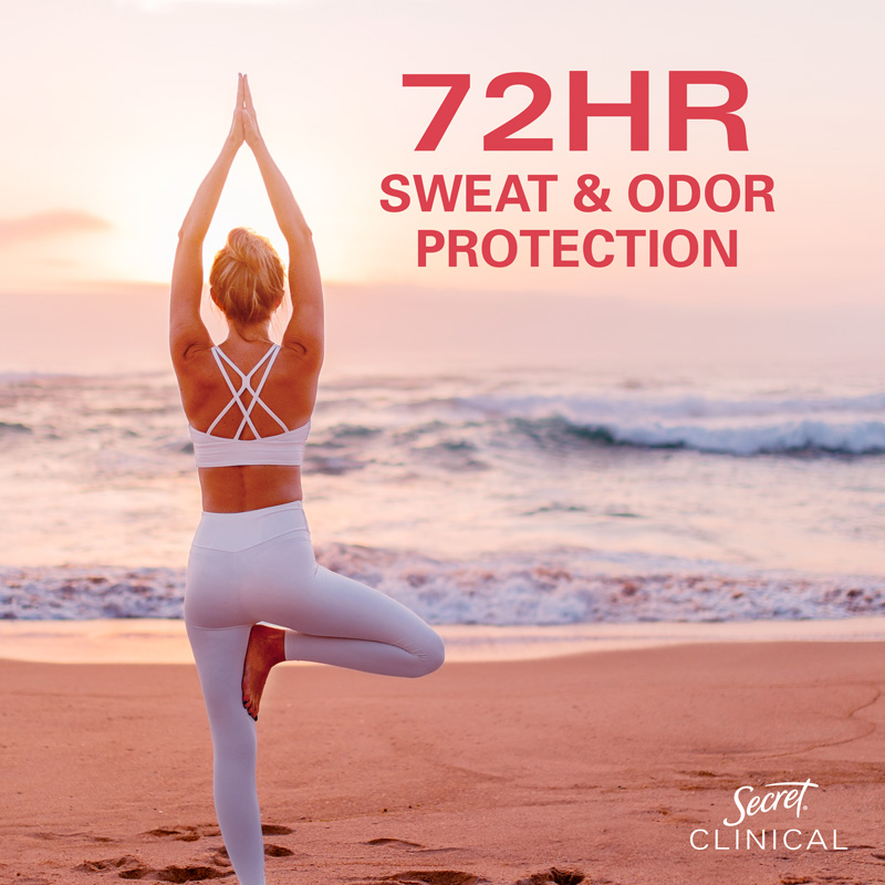 Woman practicing yoga on the beach at sunset, promoting 72-hour sweat and odor protection by Secret Clinical