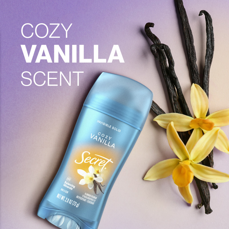 Cozy vanilla scent Secret deodorant with natural vanilla pods and flowers on a gradient background, showcasing its inviting aroma and freshness