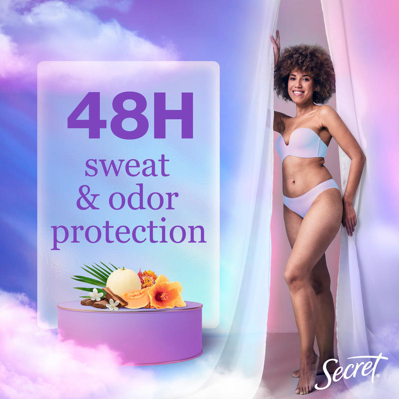 Model showcasing Secret deodorant emphasizing 48-hour sweat and odor protection, with floral display and soft pastel background