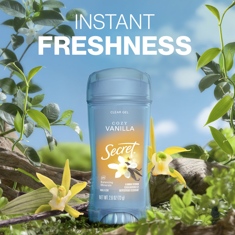 Instant freshness. Secret clear gel antiperspirant stick in Cozy Vanilla scent surrounded by green leaves and flowers