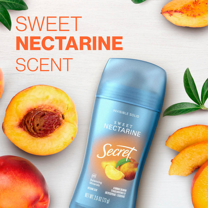 Secret deodorant stick featuring Sweet Nectarine scent, surrounded by fresh nectarines and peach slices on a light background
