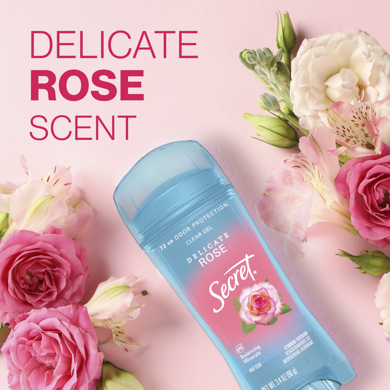 A Secret clear gel deodorant with delicate rose scent surrounded by fresh pink flowers on a soft pastel pink background. Ideal for everyday freshness