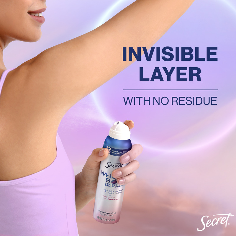 Woman applying Secret deodorant spray in a gentle motion under her arm, promoting an invisible layer with no residue left behind