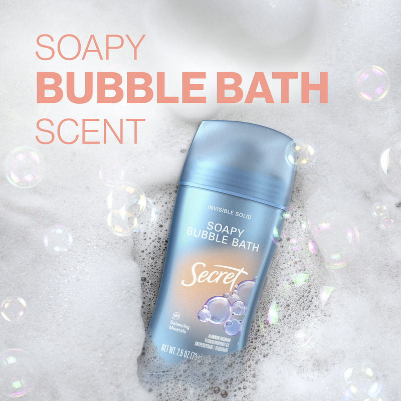 Soapy Bubble Bath scent Secret deodorant stick displayed on creamy bubbles, showcasing an invisible solid deodorant