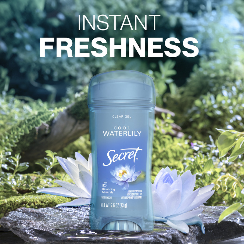 Instant freshness. Secret clear gel deodorant bottle, set against a nature backdrop with greenery and water lilies