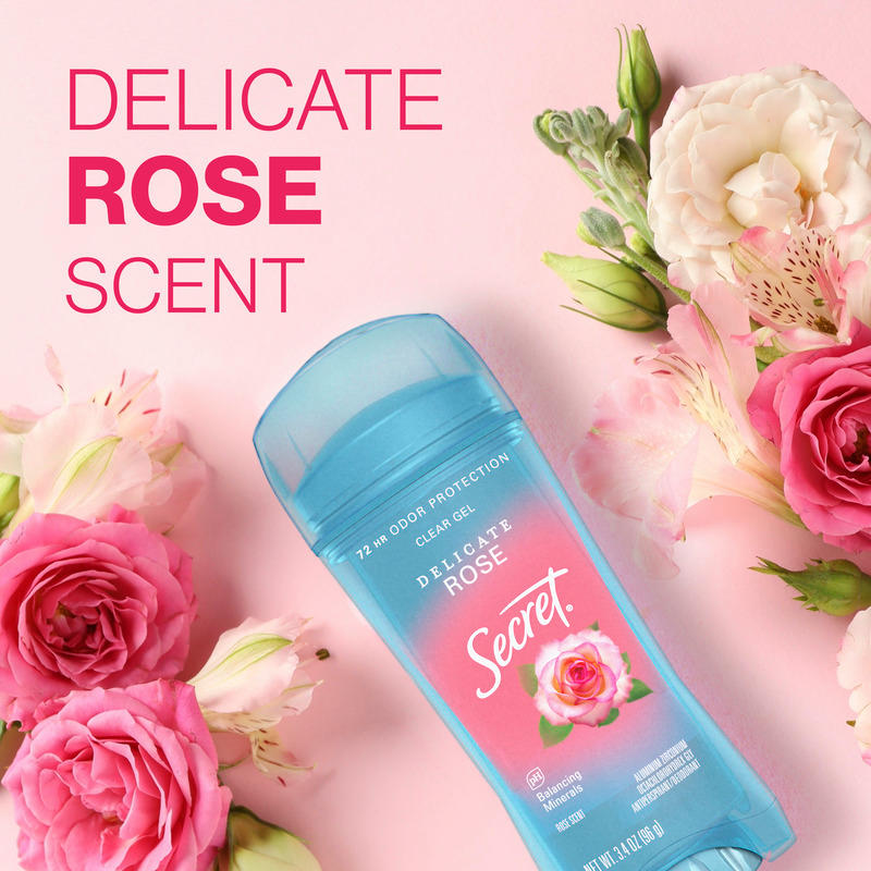 A Secret clear gel deodorant with delicate rose scent surrounded by fresh pink flowers on a soft pastel pink background. Ideal for everyday freshness