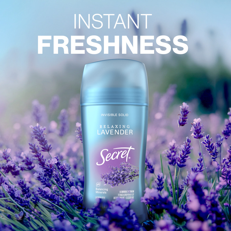 Instant freshness. Secret clear gel deodorant bottle, set against a field backdrop with lavander plant in the background