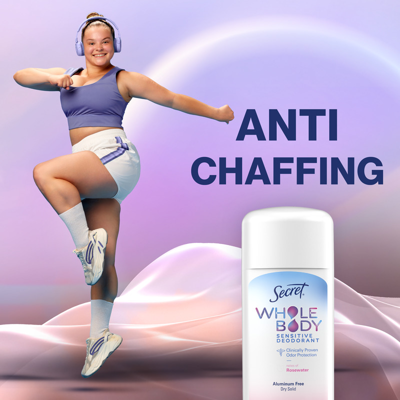 A joyful person wearing sportswear dances energetically next to a Secret dry solid stick, promoting a product that prevents chafing and absorbs sweat