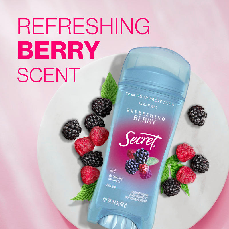 Refreshing berry scent. Secret clear gel deodorant, surrounded by fresh raspberries and blackberries on a plate, set against a pink background
