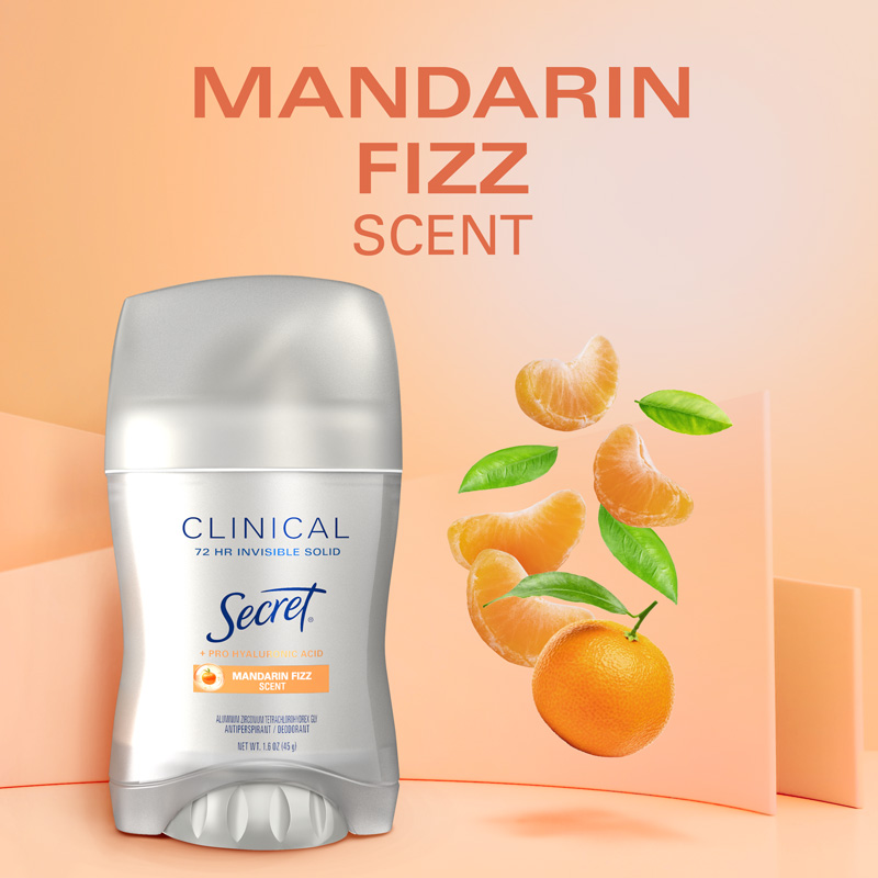 Secret Clinical Invisible Solid Mandarin Fizz deodorant stick with vibrant citrus fruits in the background