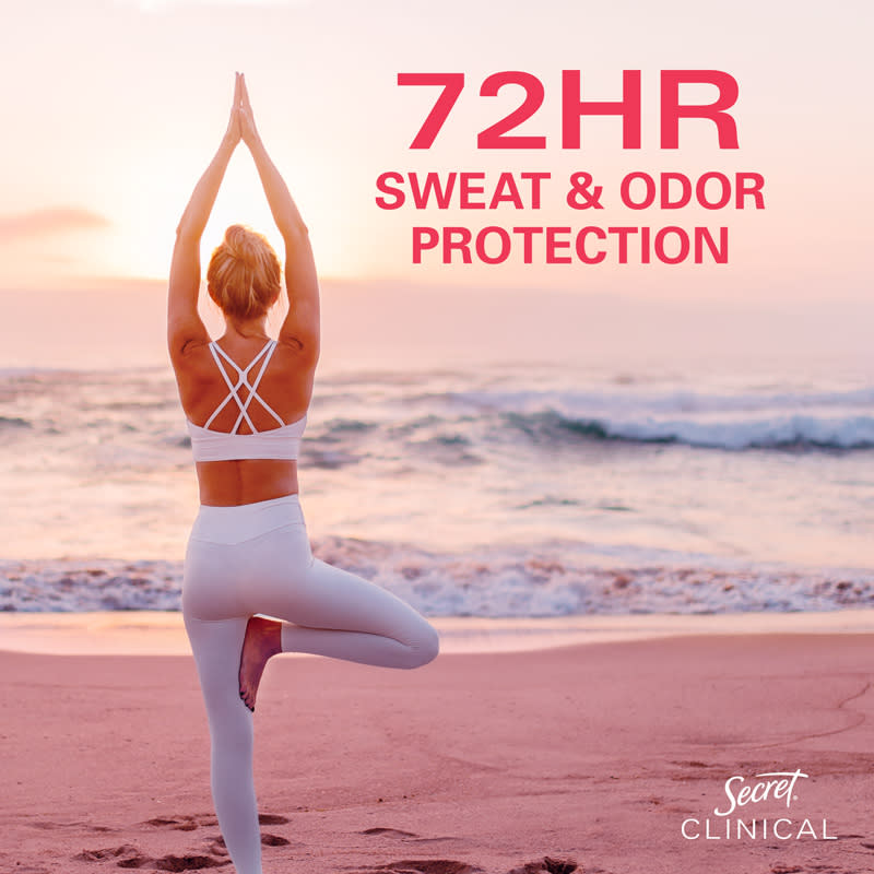 Woman practicing yoga on the beach at sunset, promoting 72-hour sweat and odor protection benefits