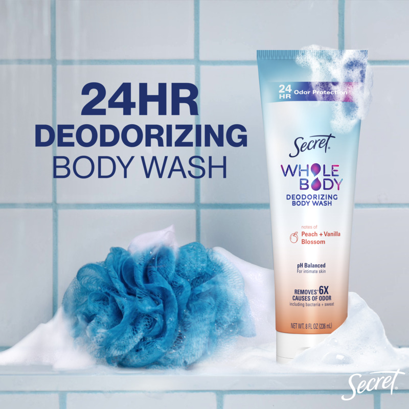 24HR deodorizing body wash by Secret with notes of peach and vanilla blossom in a bathroom setting