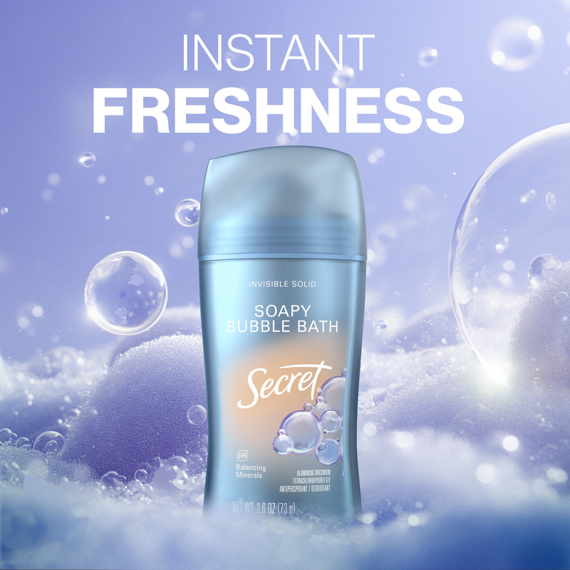 Instant freshness. Soapy bubble bath scented Secret deodorant stick on a soft bubble background highlighting instant freshness benefit