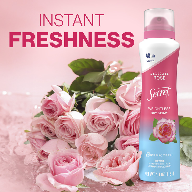 A bottle of Secret Weightless Dry Spray next to a bouquet of pink roses, promoting instant freshness and long-lasting fragrance for users