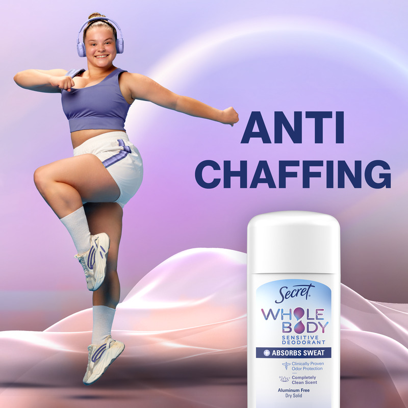 A joyful person wearing sportswear dances energetically next to a Secret dry solid stick, promoting a product that prevents chafing and absorbs sweat