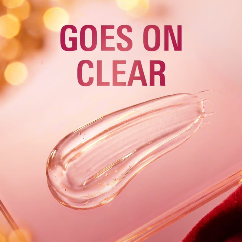 Clear gel texture spread on a smooth surface, with warm blurred background and text overlay saying Goes On Clear
