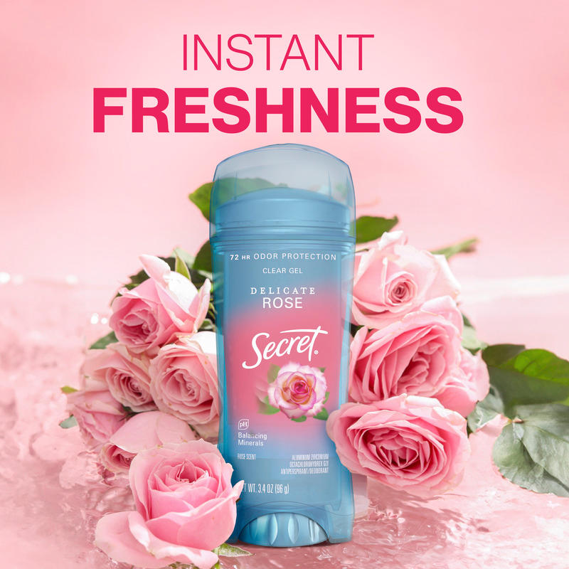 Instant freshness. Secret clear gel deodorant in Delicate Rose scent surrounded by pink roses on a cozy rose-themed background