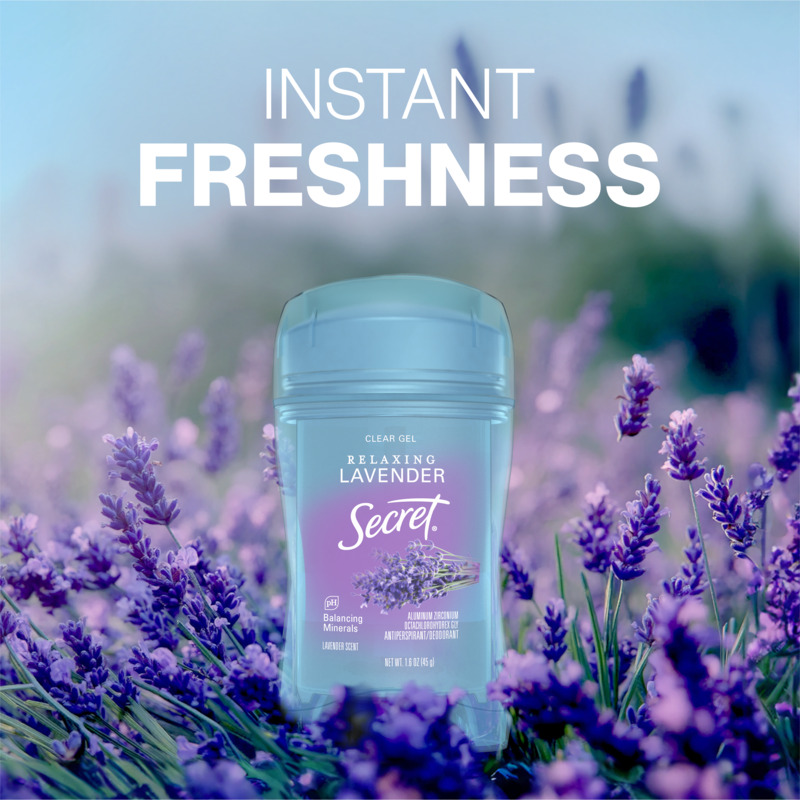 Instant freshness. Secret clear gel deodorant bottle, set against a field backdrop with lavander plant in the background