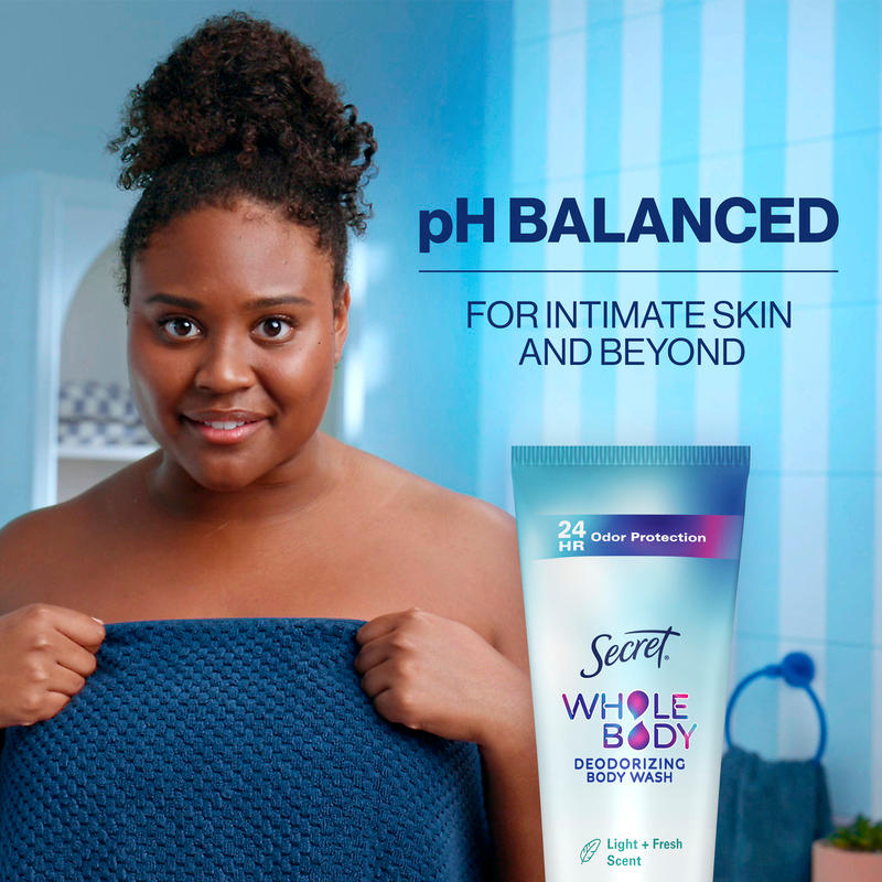 Woman holding a towel with a deodorizing body wash product displayed, emphasizing pH balanced care for intimate skin