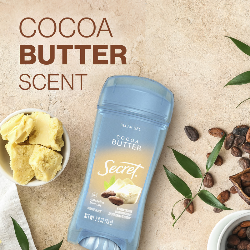 Cocoa butter scented deodorant with Secret clear gel formula, surrounded by cocoa beans and shea butter, showcasing natural skincare ingredients