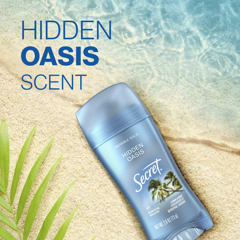 Secret deodorant stick, Hidden Oasis scent on a sandy beach with tropical plants and clear water, promoting freshness and comfort