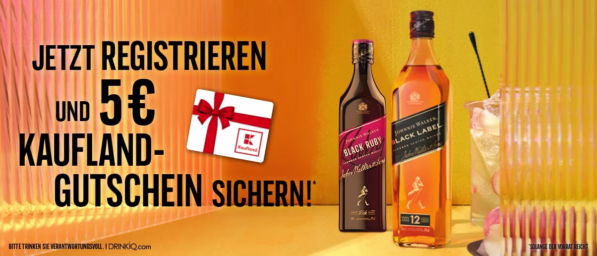 Two Johnnie Walker whisky bottles, a Kaufland gift card, and a glass on a yellow-orange background.