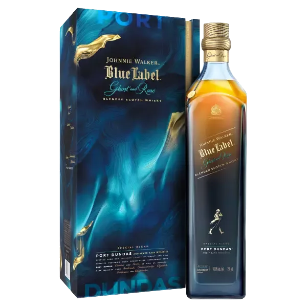A bottle of Johnnie Walker Blue Label Ghost and Rare blended Scotch whisky stands next to its blue and gold box, featuring swirling designs and premium branding.