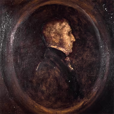 A close-up of a sepia-toned portrait. The subject is a man in profile, his face illuminated by a soft light. The background is dark and textured, giving the portrait a sense of depth and mystery.