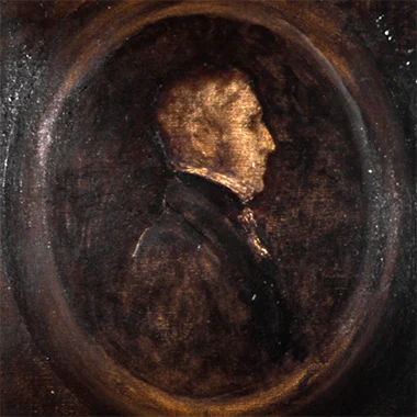 A close-up of a sepia-toned portrait. The subject is a man in profile, his face illuminated by a soft light. The background is dark and textured, giving the portrait a sense of depth and mystery.