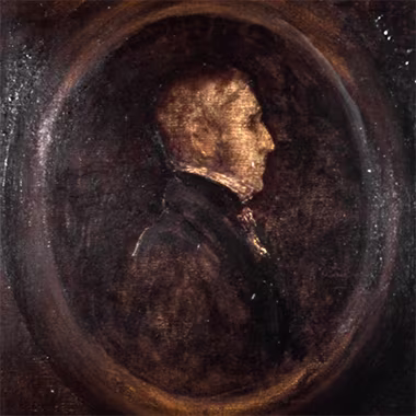A close-up of a sepia-toned portrait. The subject is a man in profile, his face illuminated by a soft light. The background is dark and textured, giving the portrait a sense of depth and mystery.