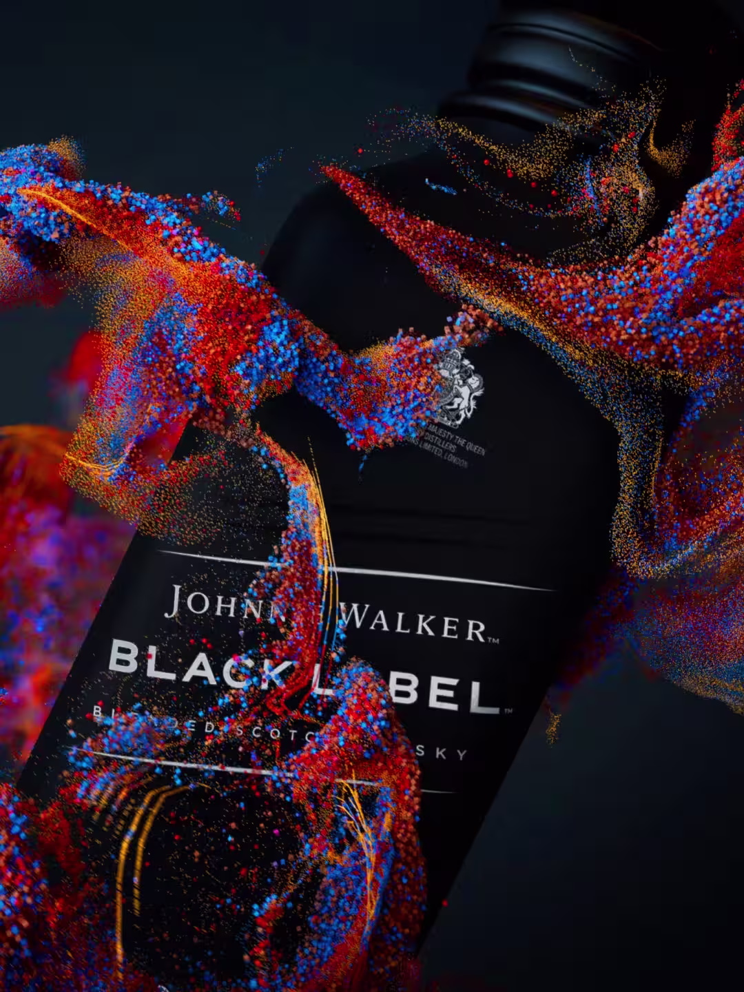 A black bottle of Johnnie Walker Black Label whiskey with vibrant red, blue, and gold powder splashing around it on a dark background.