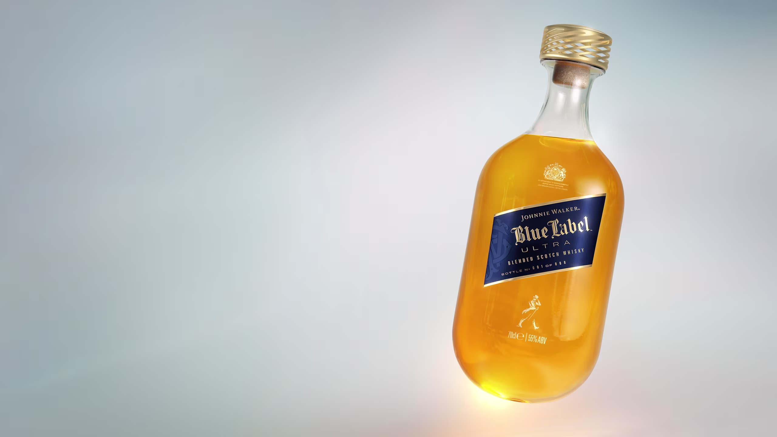 A tilted bottle of Johnnie Walker Blue Label Ultra whisky with a gold cap and blue label, filled with amber liquid, set against a light gradient background.