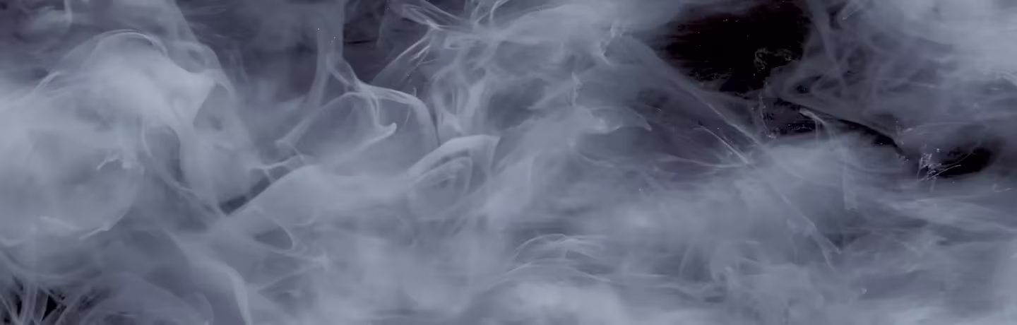  Thick white smoke or fog swirls against a dark background, creating a mysterious and ethereal atmosphere.