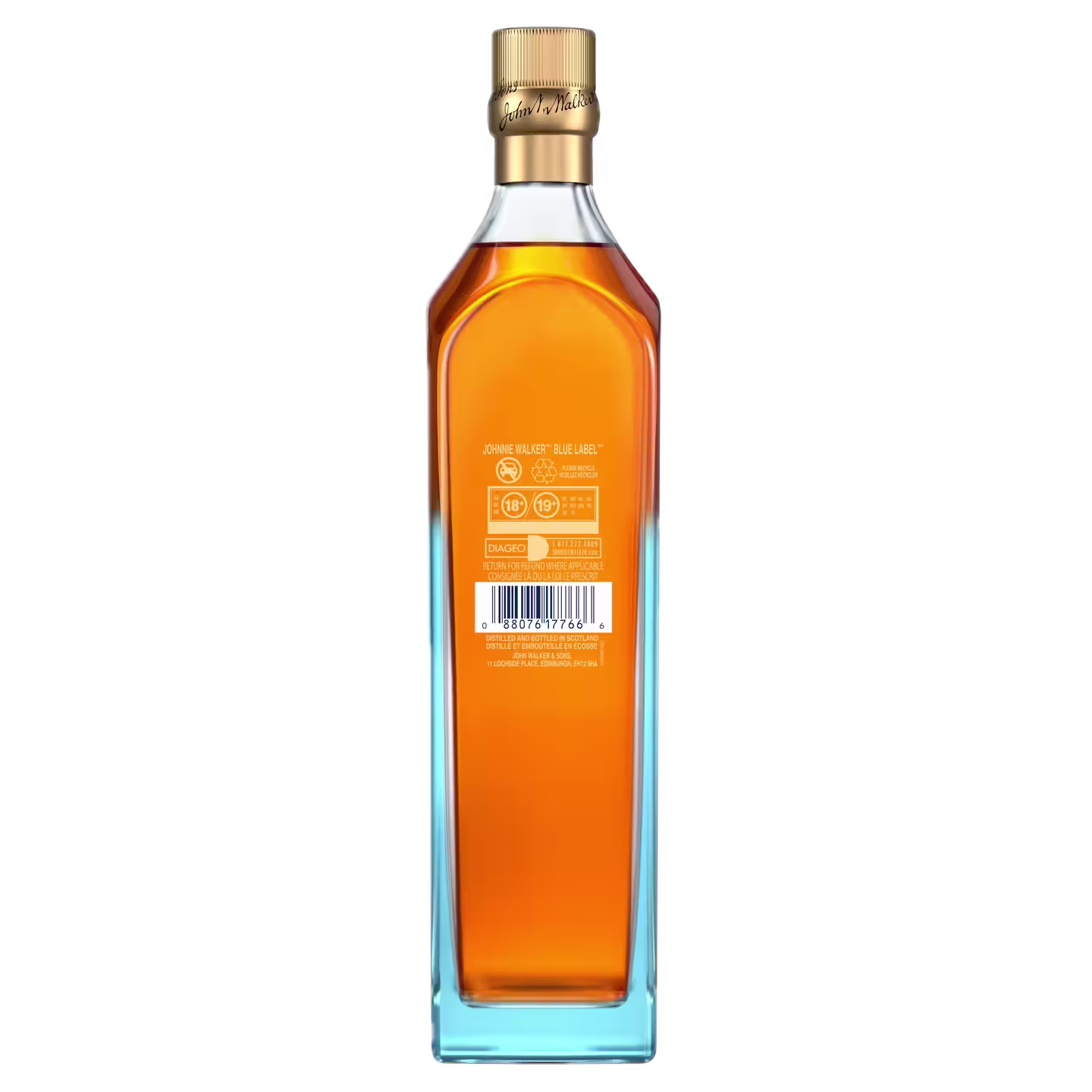 A tall, rectangular glass bottle filled with amber liquid, sealed with a gold cap. The bottle has a barcode, text, and symbols on the back label, and is set against a plain white background.