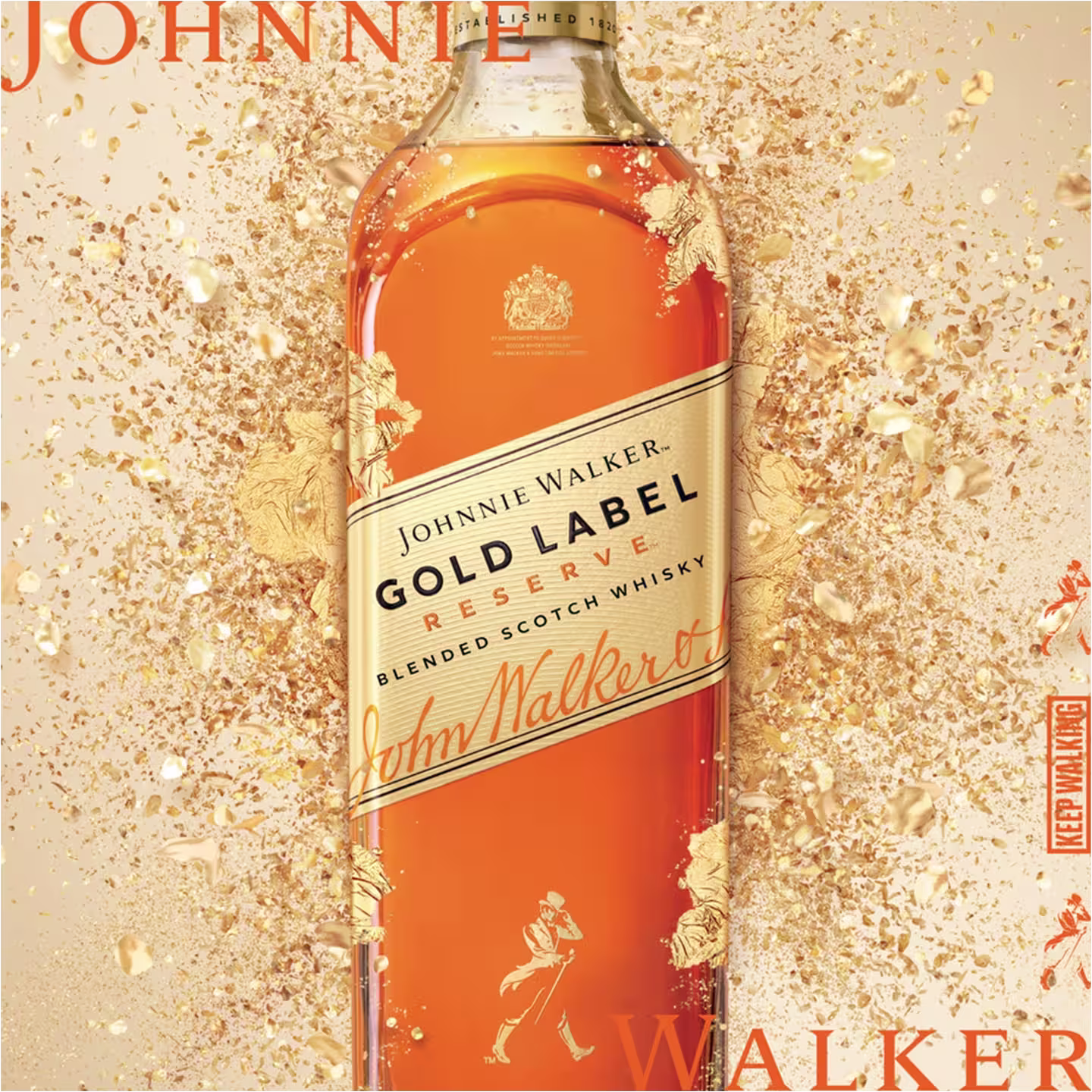 A bottle of Johnnie Walker Gold Label Reserve blended Scotch whisky stands upright, surrounded by golden splashes and sparkles. The label features the Johnnie Walker logo and branding.
