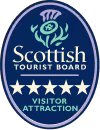 Blue and white logo of the Scottish Tourist Board features a thistle design, the text Scottish Tourist Board, and five stars above the words Visitor Attraction.