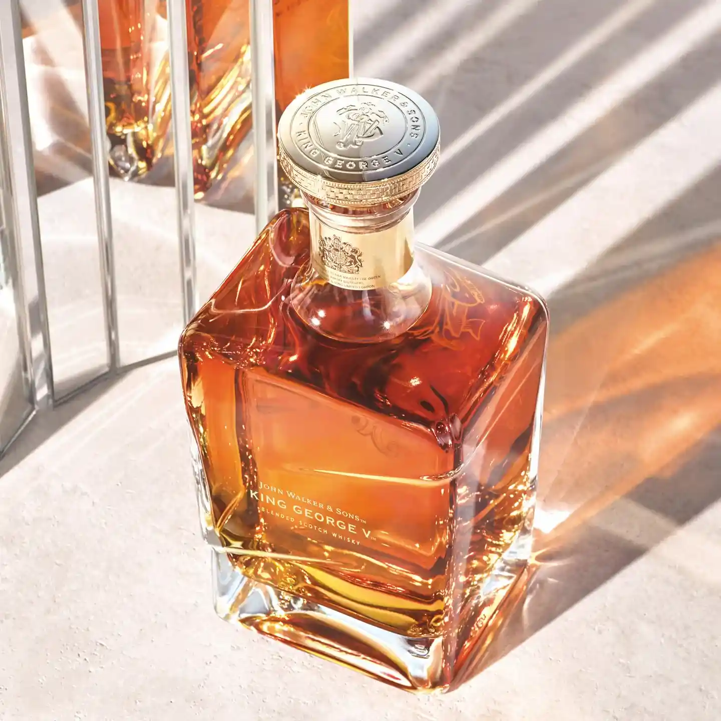 A bottle of John Walker & Sons King George V blended Scotch whiskey. 
