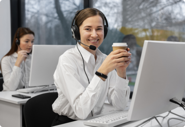 Woman with coffee at desk