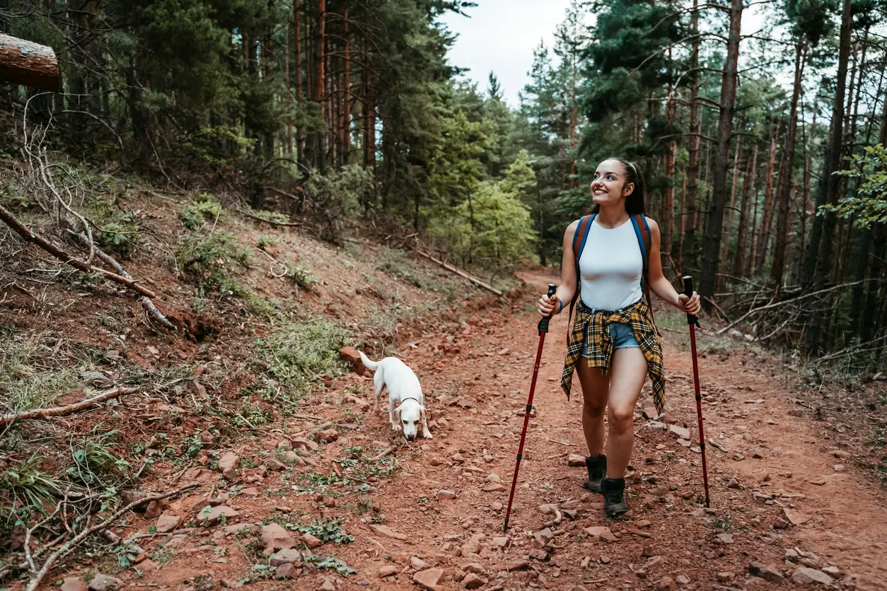 Girl hiking with dog