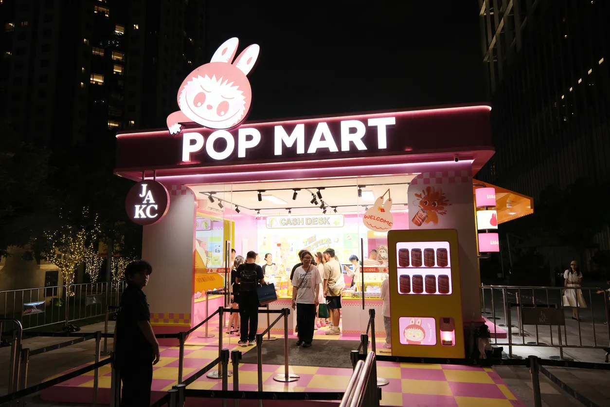 people standing around a bright shop