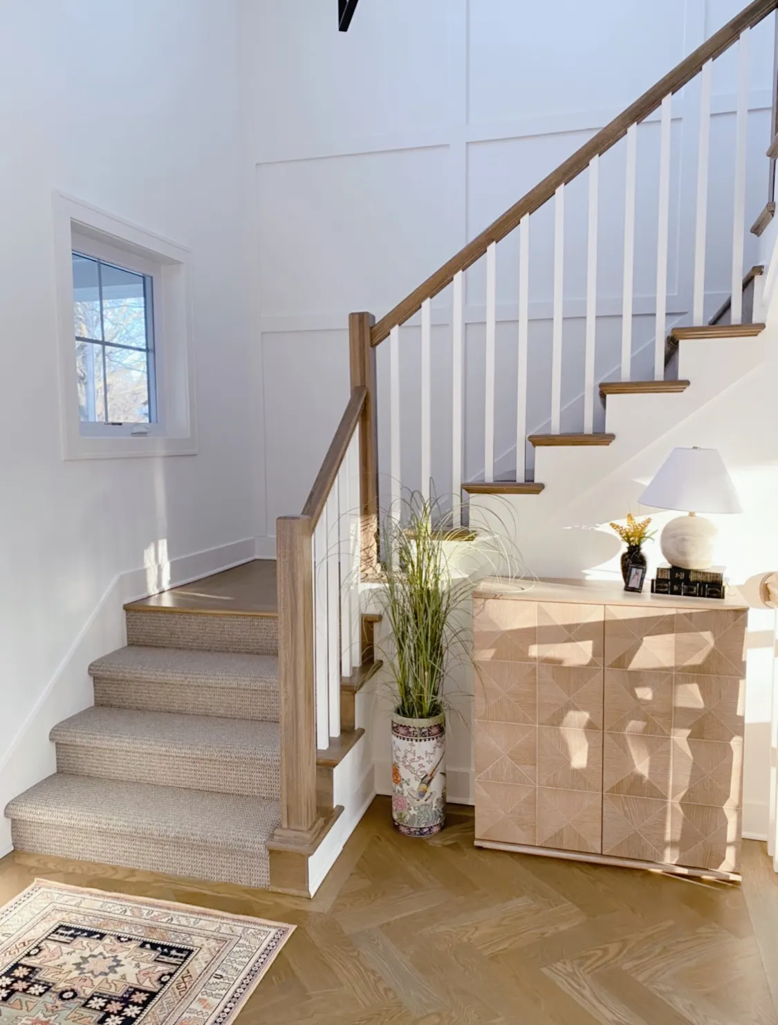 Stairwell with console table and lamp