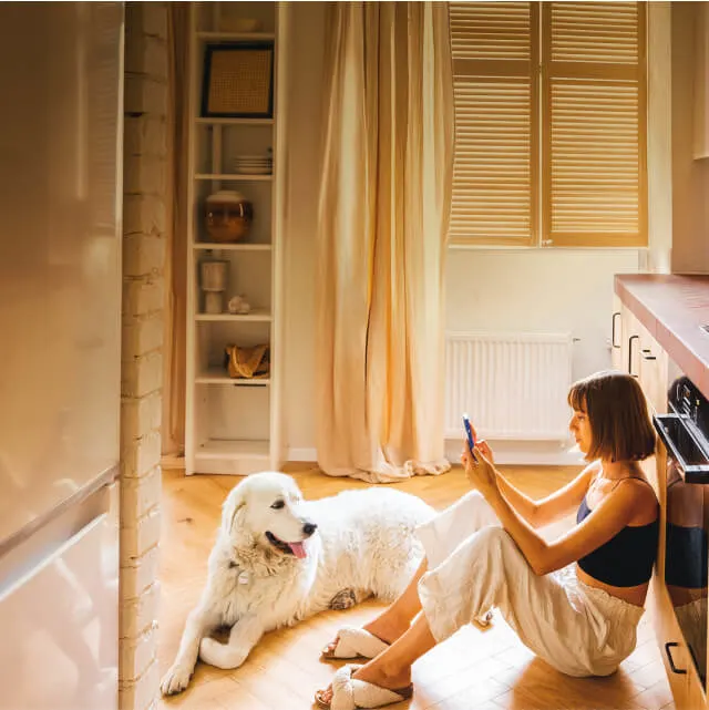 photo-woman-sitting-on-floor-with-dog-640w-sm v2