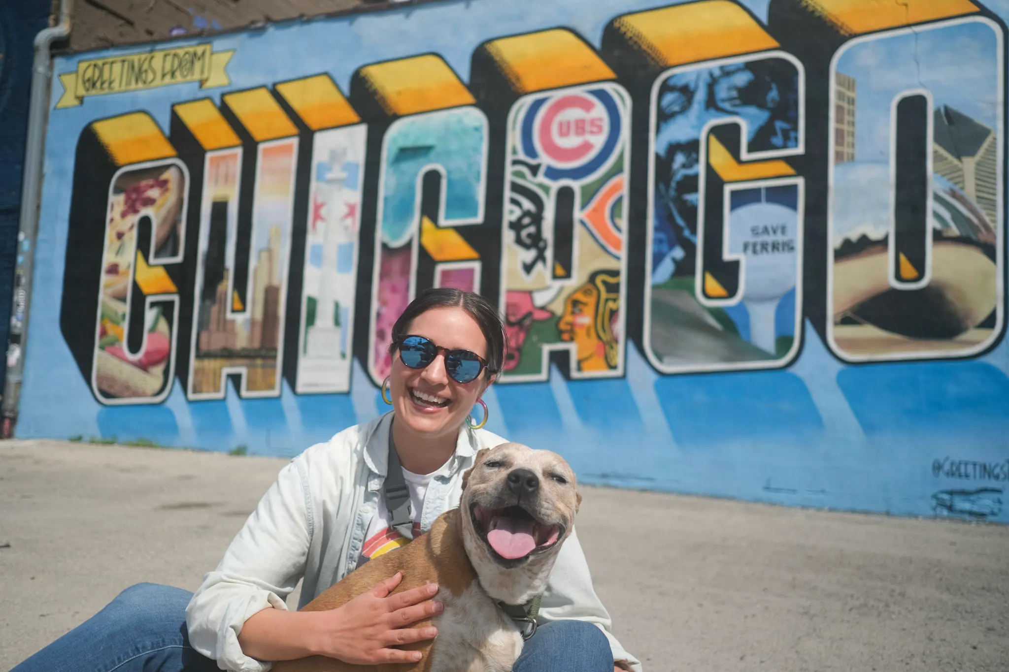 Woman sitting with smiling dog