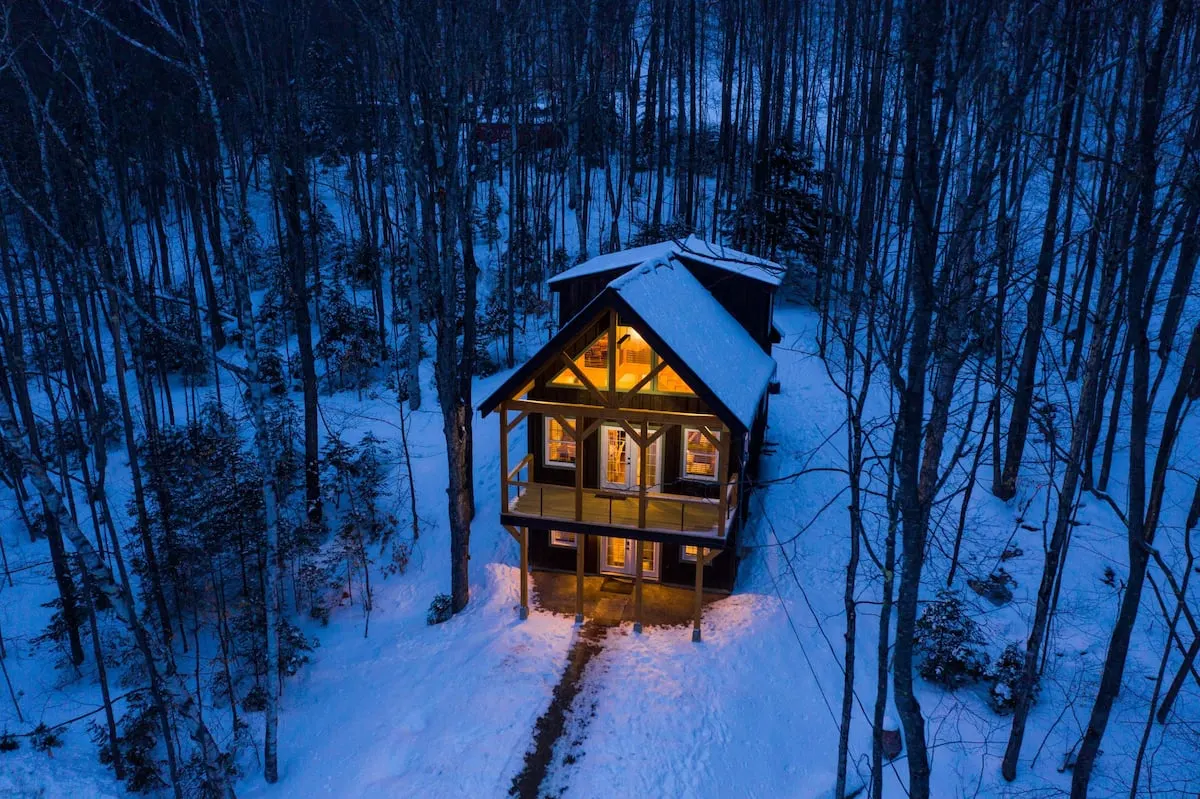 large cabin in snow in New Hampshire