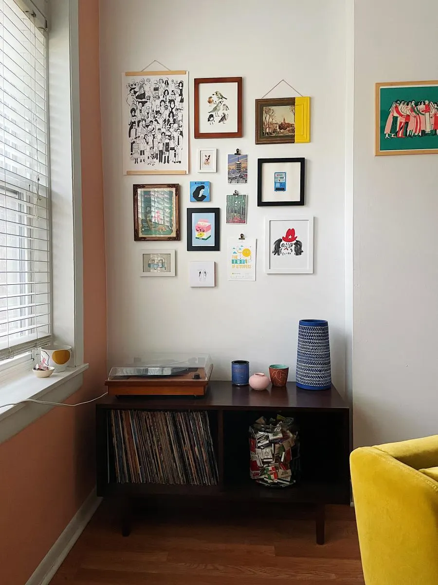 Living room corner with record player and wall art
