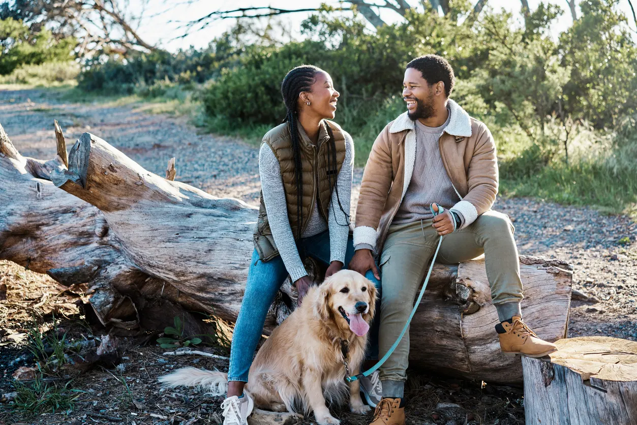 couple hiking with dog