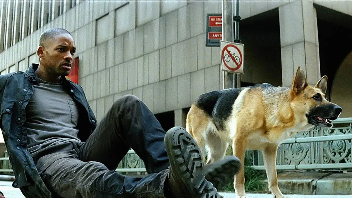 Will smith on ground next to german shepherd